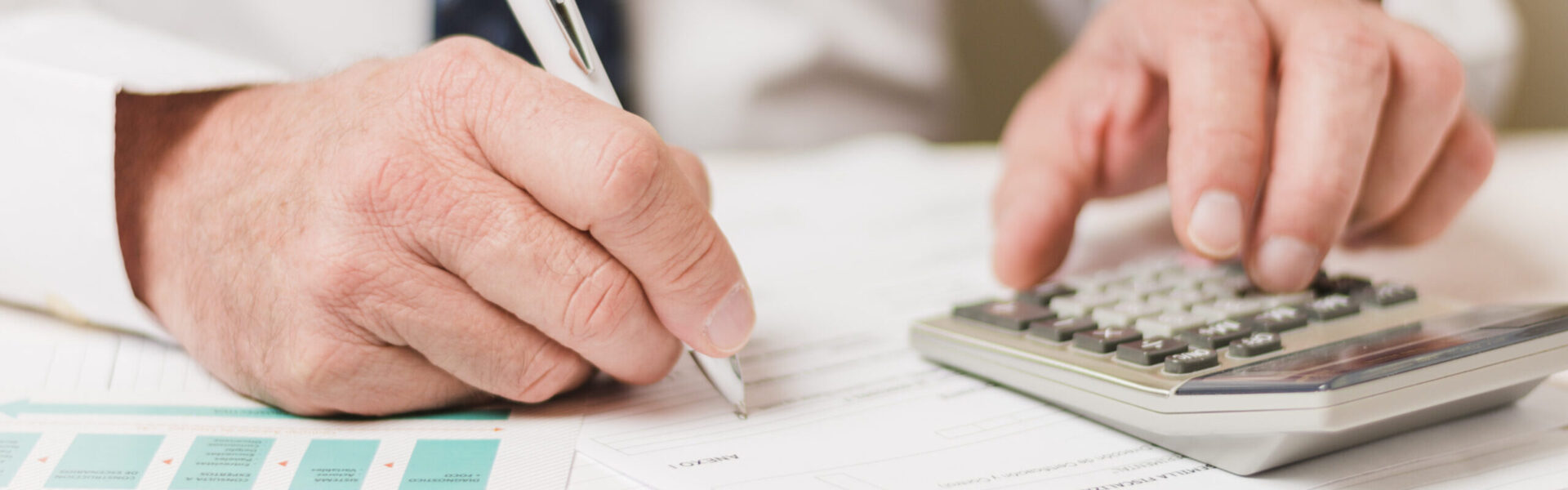 businessman-using-calculator